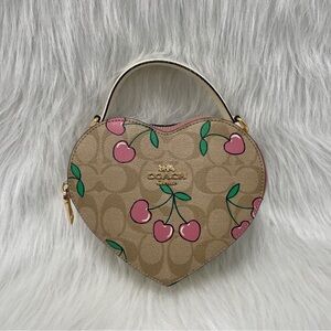 🕊️🌿WOMEN’S HEART CROSSBODY SIGNATURE CANVAS HEART CHERRY PRINT🦩